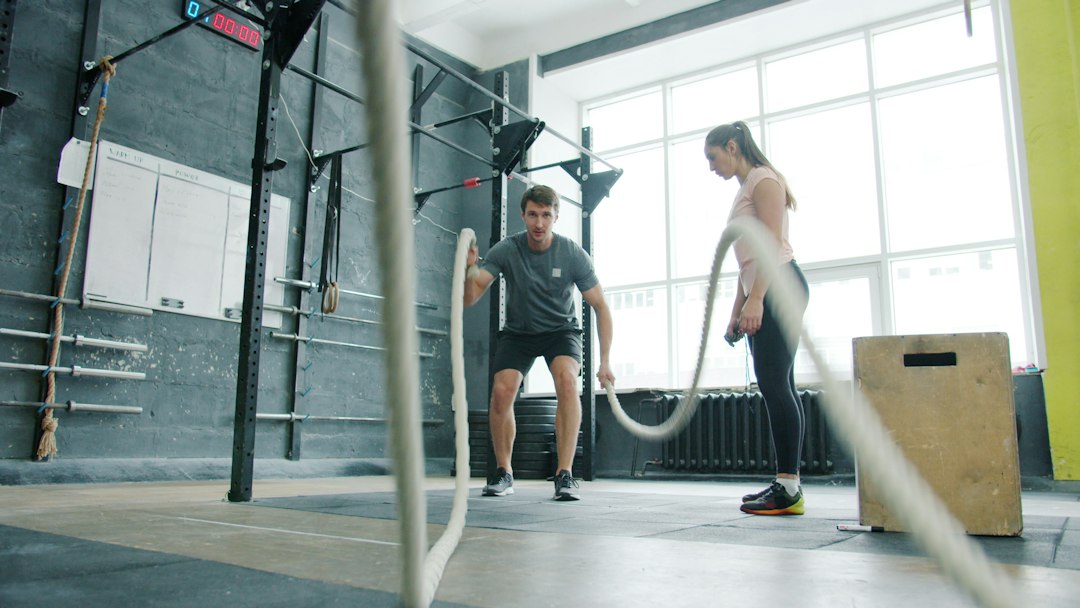 Adult performing a circuit training workout that combines cardio and strength exercises